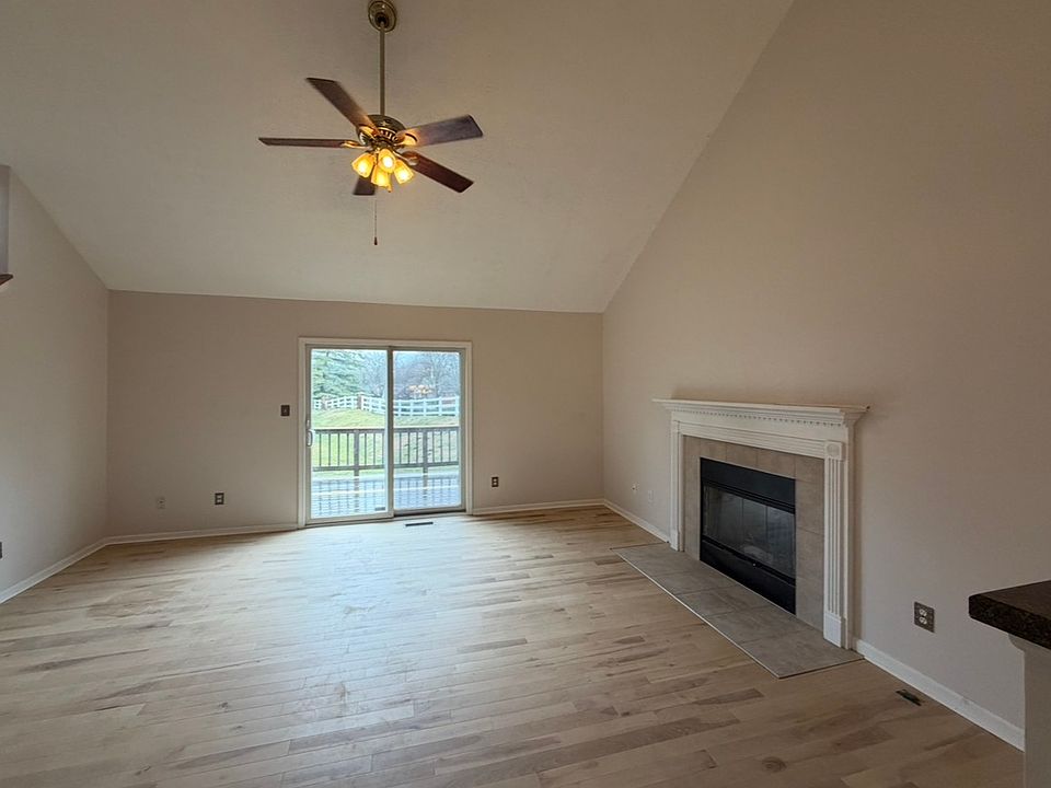 Living Room with Gas Fireplace and Birch Flooring.
