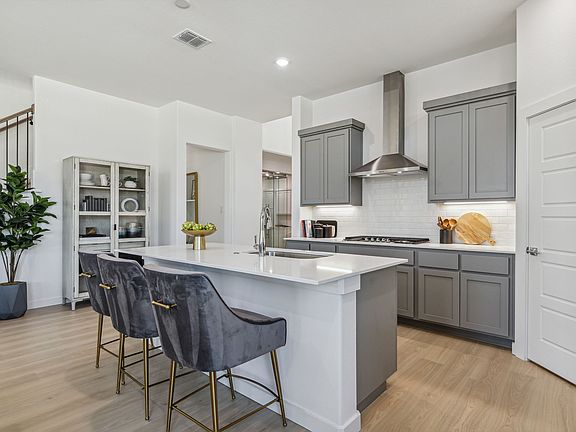 Kitchen in the Van Gogh II home plan by Trophy Signature Homes - REPRESENTATIVE PHOTO