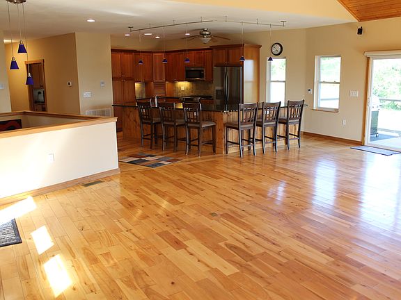 Open concept kitchen and living room with beautiful views out every window.