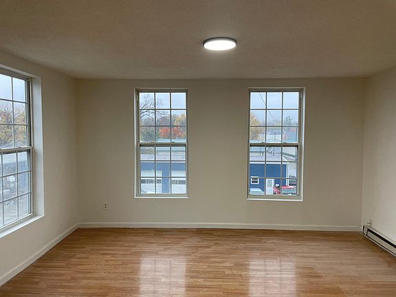 Living Room with laminate wood flooring.