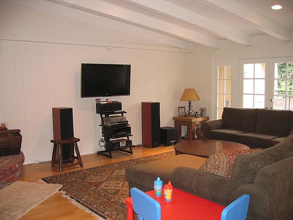 The huge living room features hi-beamed,tongue'n grooved ceiling 