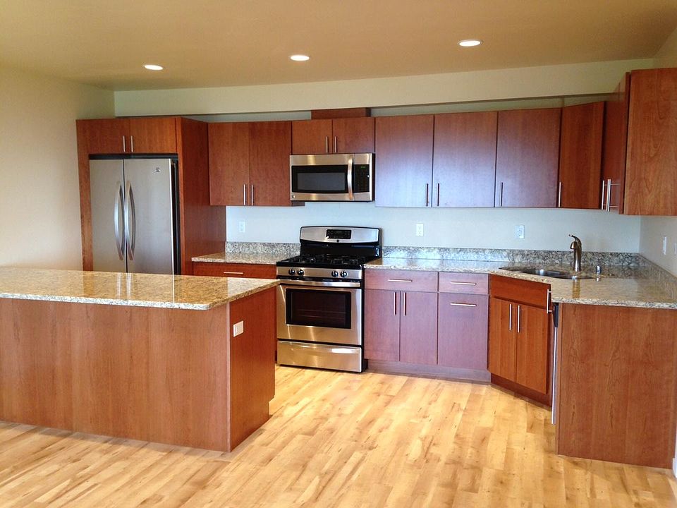 Kitchen, dining and living room are included in one 20' x 16' room.