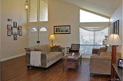 Big open floorplan with vaulted ceilings and wood style flooring
