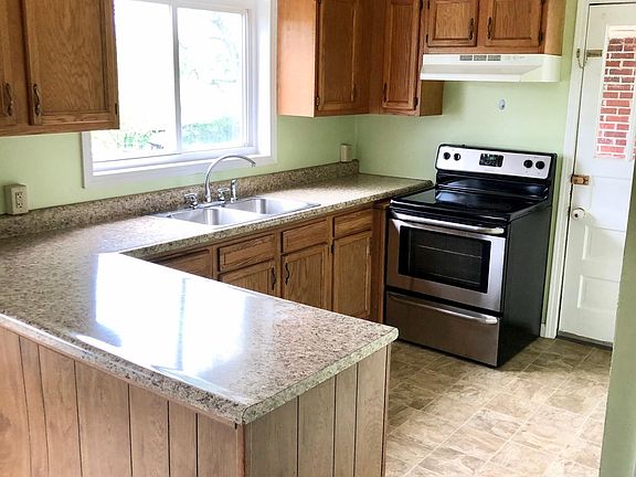 Kitchen Area with Stainless Steel Stove.