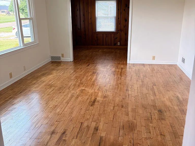living room with hardwood floors on east side of home