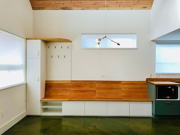Built-in entry closet / coat rack / shoe shelf / dining bench.