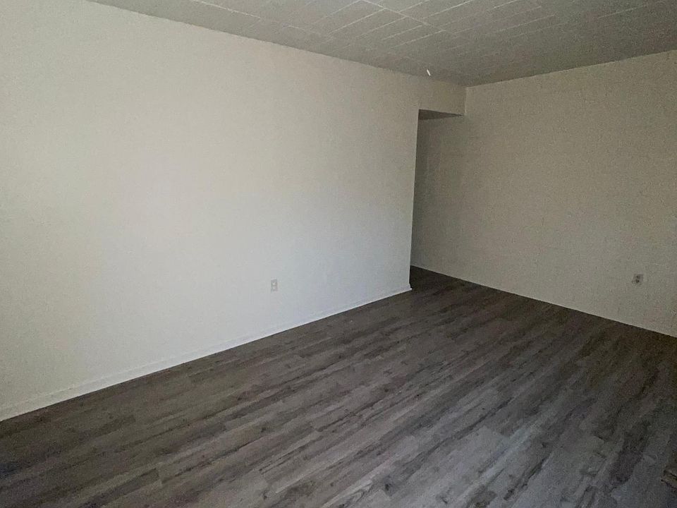 Inside apartment aimed at front door from living room