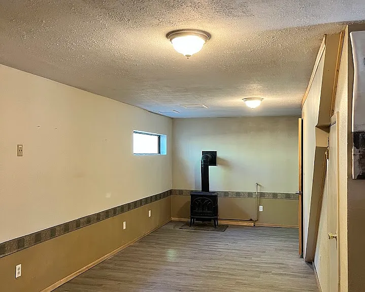 Downstairs living area with gas stove.