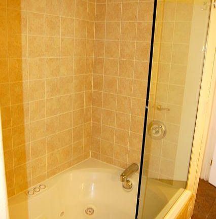 whirlpool tub and rain shower head