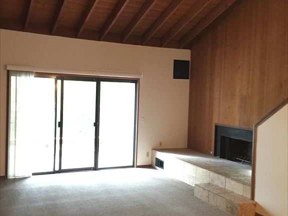 Main living area, vaulted ceilings and fireplace