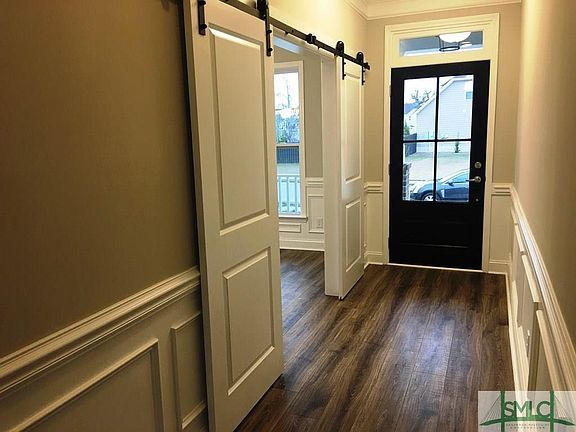 Amazing Foyer With Barn Door Sliders To Study Dining Room
