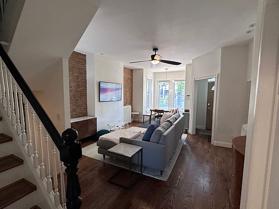 Living room with bright bay window perfect for a dining space