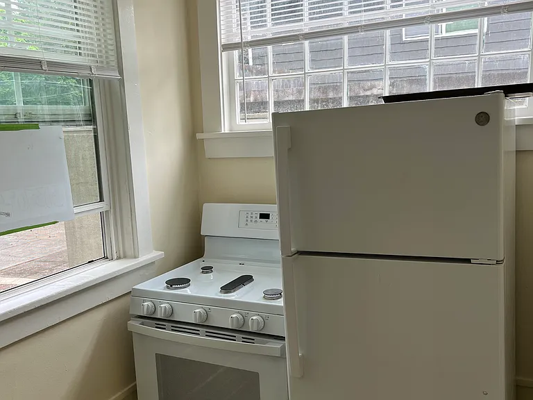Full size gas stove and full size fridge