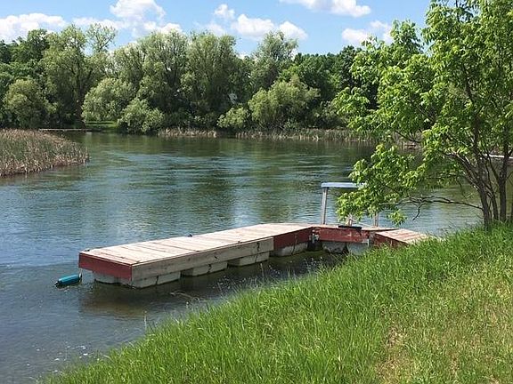 9.21 Acre Resid/Recreational Site w-Otter Tail River on 3 Sides! 28120 Redhead Dr, Underwood, MN: floating dock-river view