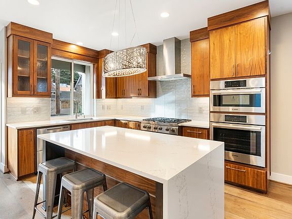 Waterfall island with modern chefs kitchen.