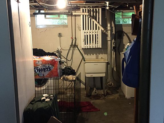 Basement Laundry with laundry shoot from 1st and 2nd floor.