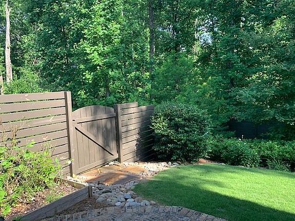 Oversized, heavily wooded, fenced yard