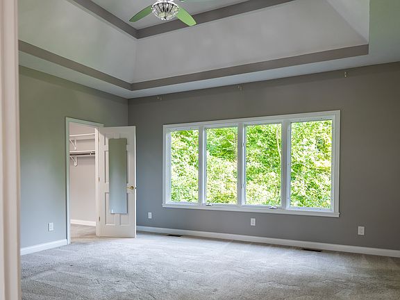The owner's suite is large with a beautiful tray ceiling and TWO walk-in closets!