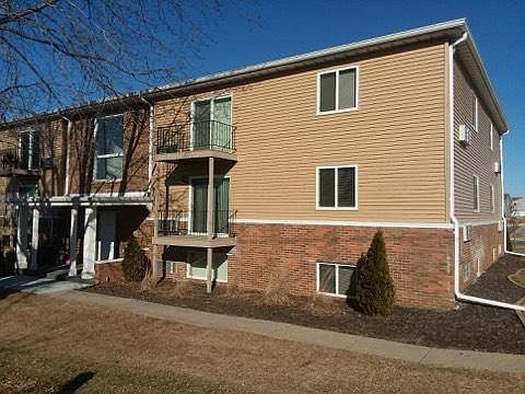 Exterior of the building with new siding and roof