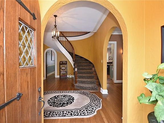Arched doorways lead into grand entry.