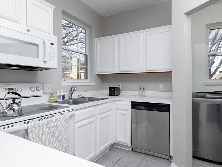Fully stocked kitchen with ample counter space, stainless steel appliances, toaster, and kettle_everything you need to cook, snack, or sip in comfort.