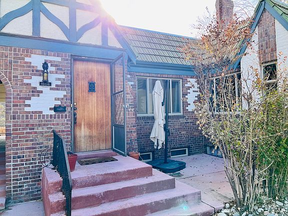 Front entrance, showing private patio with sunshade
