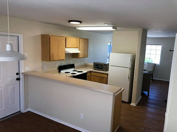 Semi open concept from dining, kitchen into living area.