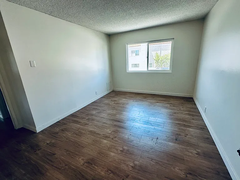 Another Pic of the Large Master Bedroom (weird angle, looks smaller than it really is. Walk-in Closet directly behind camera, hallway access and private bath to the left