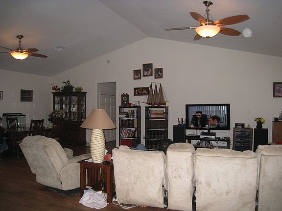 Open Living/Dining Area with cathedral ceilings and ceiling fans