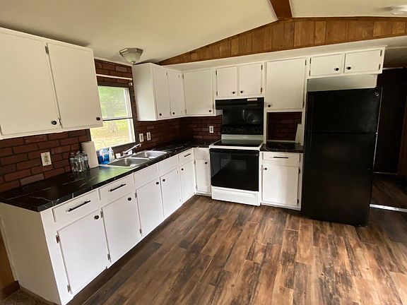 Kitchen with new countertops, paint, and flooring