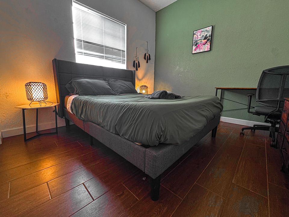 Queen bed with mini fridge and 4K Smart TV