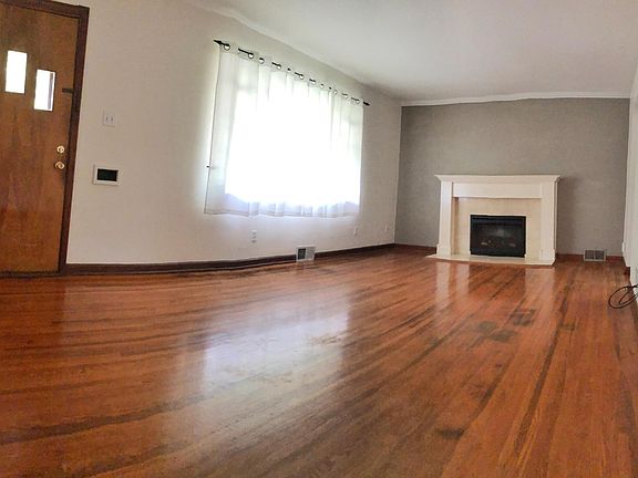 Living room with electric fireplace offering heat, the sound (but not the work) of a wood fire and adjustable glow.
