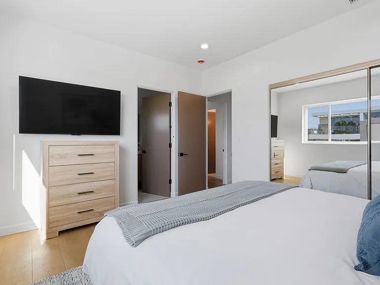 Bedroom 2 features full bathroom, large closet, and stunning ocean views.