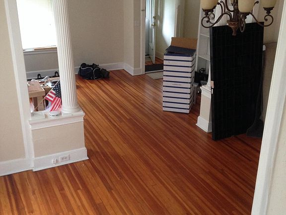 Dining room and living room seen from dining room stairs.