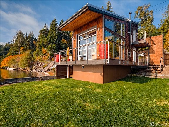 Enjoy amazing Hood Canal views and 60' +/- of waterfront with bulkhead and tideland rights. There is water level storage for water toys with a ramp to the water's edge.