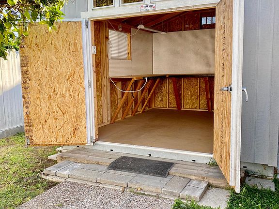 Backyard shed--OR--classroom, gym or office. Windows and skylights