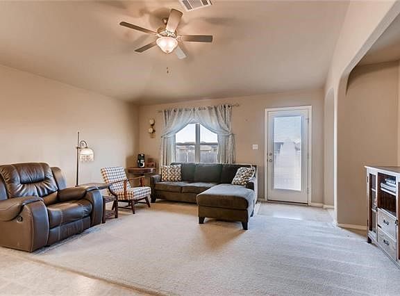 A short hallway leads you to the main area of the home with the bright living room.