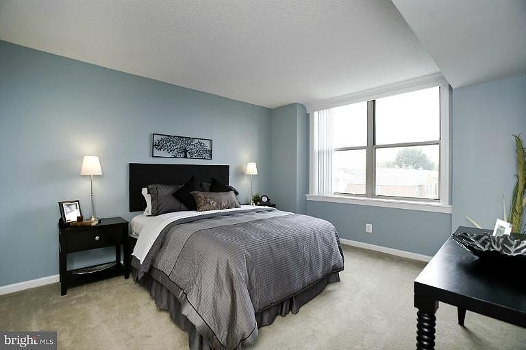 Huge bedroom with lots of light and view of Masonic Temple