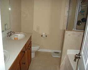 Large master bath with tile floor and shower!