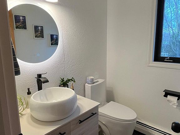 Next to kitchen is the half bath for guests