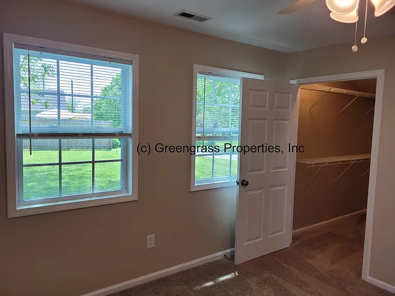 Master Bedroom with door to Walk In Closet