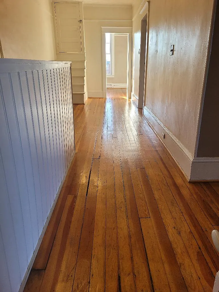 The main foyer of the apartment leads to the office at the end! - 108 Margaret St #1