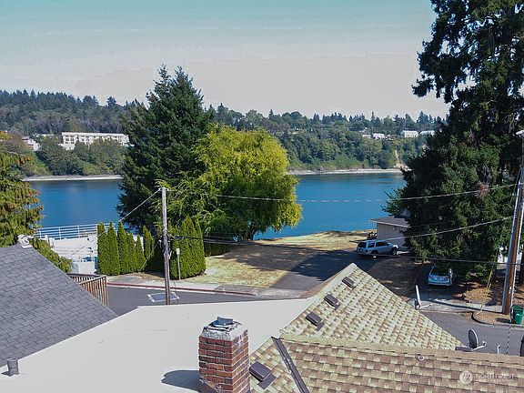 Drone shot above house roof.  Location, location, location.  >