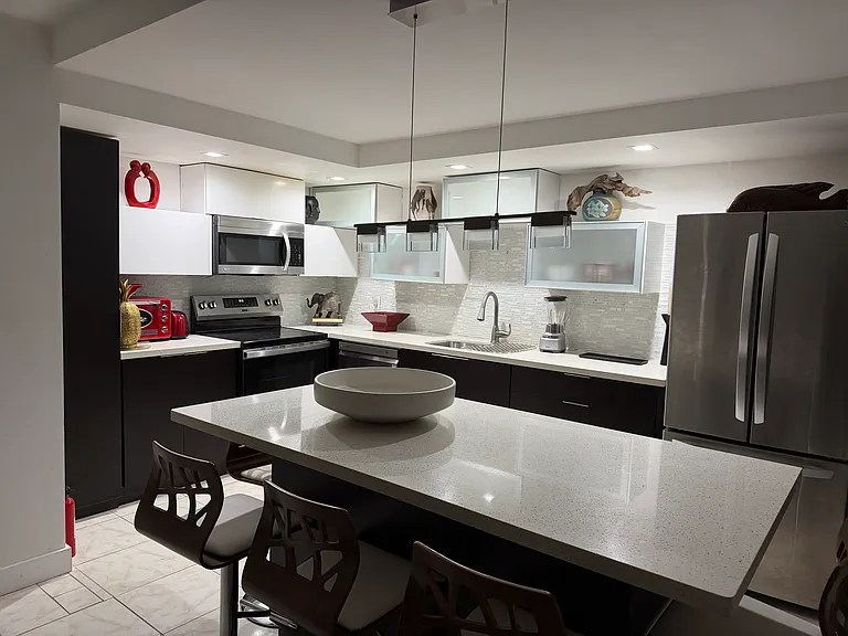 Large island open concept to living area complete move in ready