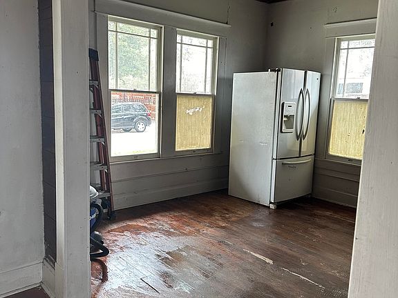Dinning room area, home has orginal wood floors.