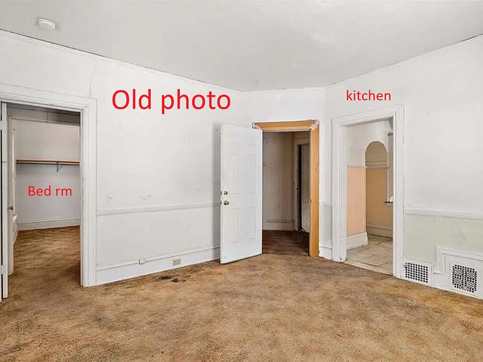 OLD PHOTO! This room is patched and painted, carpet will be last/soon! Balcony is through the kitchen.