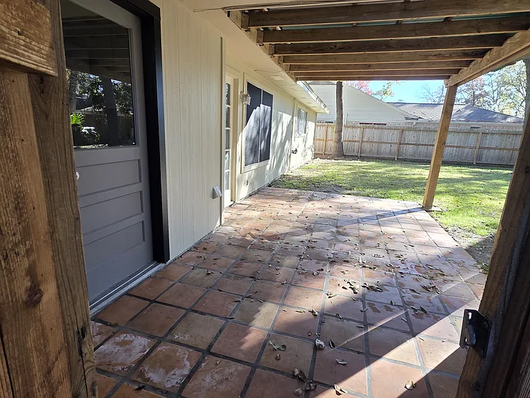 Covered backyard area to hangout with family & friends.