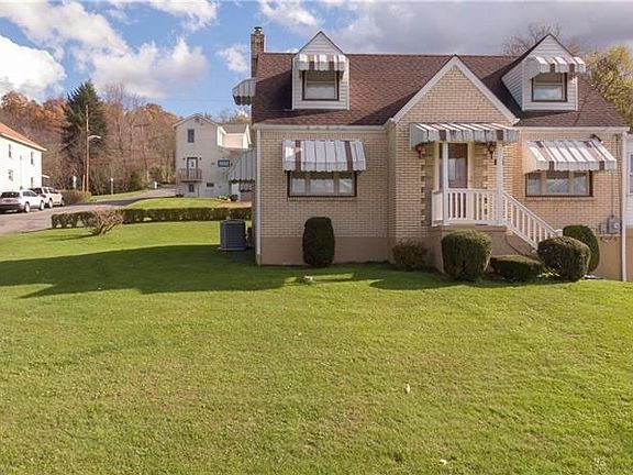 ANOTHER VIEW OF THE HOME ACCENTUATING THE NICE YARD.  LOTS OF SPACE FOR THE KIDS AND PETS TO PLAY.