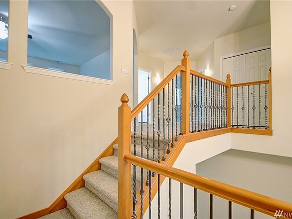 Upper level has bonus room w/celing fan, 3 bedrooms and a full bathroom.  Bonus room access panel to attic and furnace on the far wall.