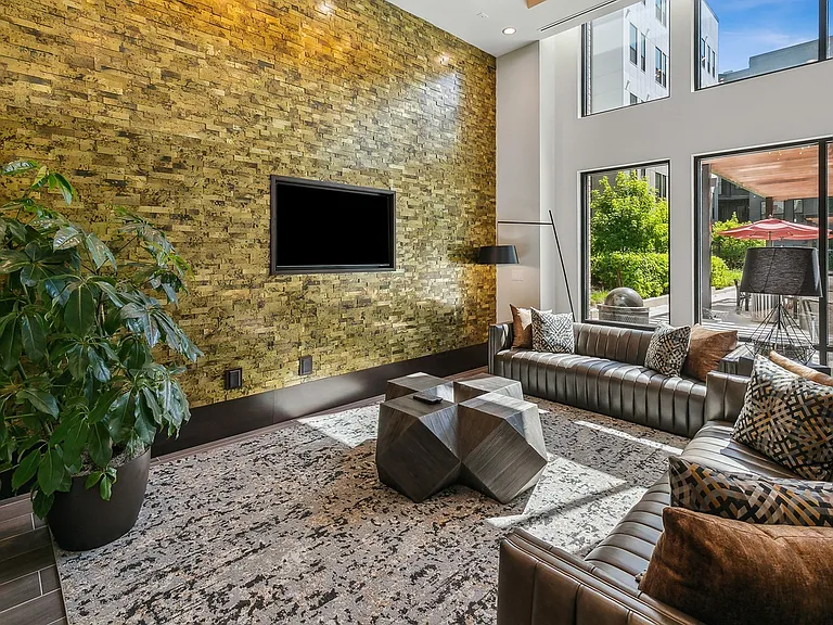 Bask in natural light and modern comfort in this inviting lounge, perfect for quiet downtime or casual conversation.